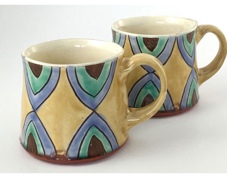 Two amber mugs by Terrie MacDonald